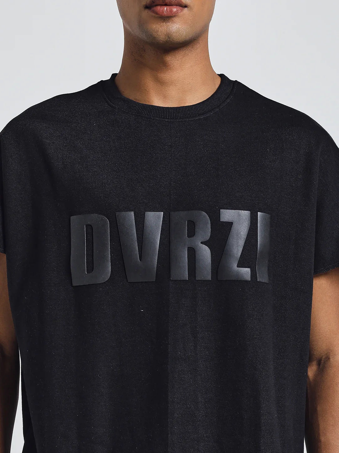 Black crew-neck T-shirt close-up of DUVRZI front graphic