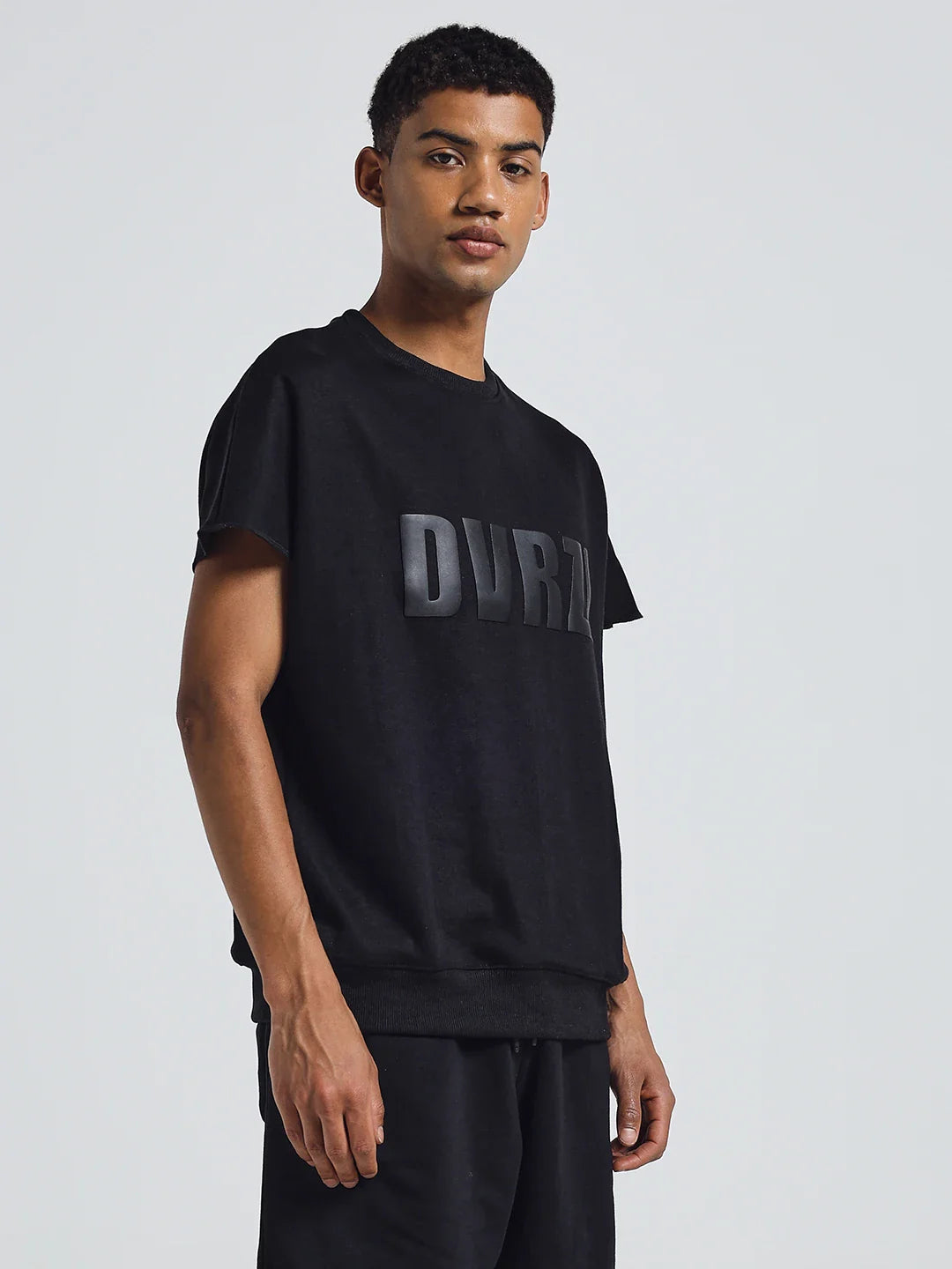 Black crew-neck T-shirt with DUVRZI logo print on the chest