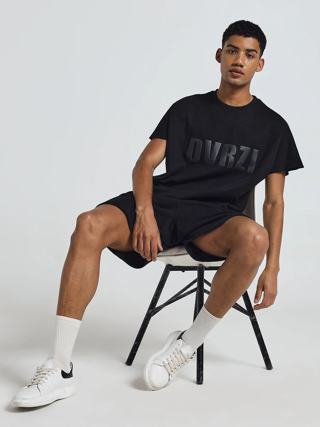Black crew-neck T-shirt with DUVRZI logo print