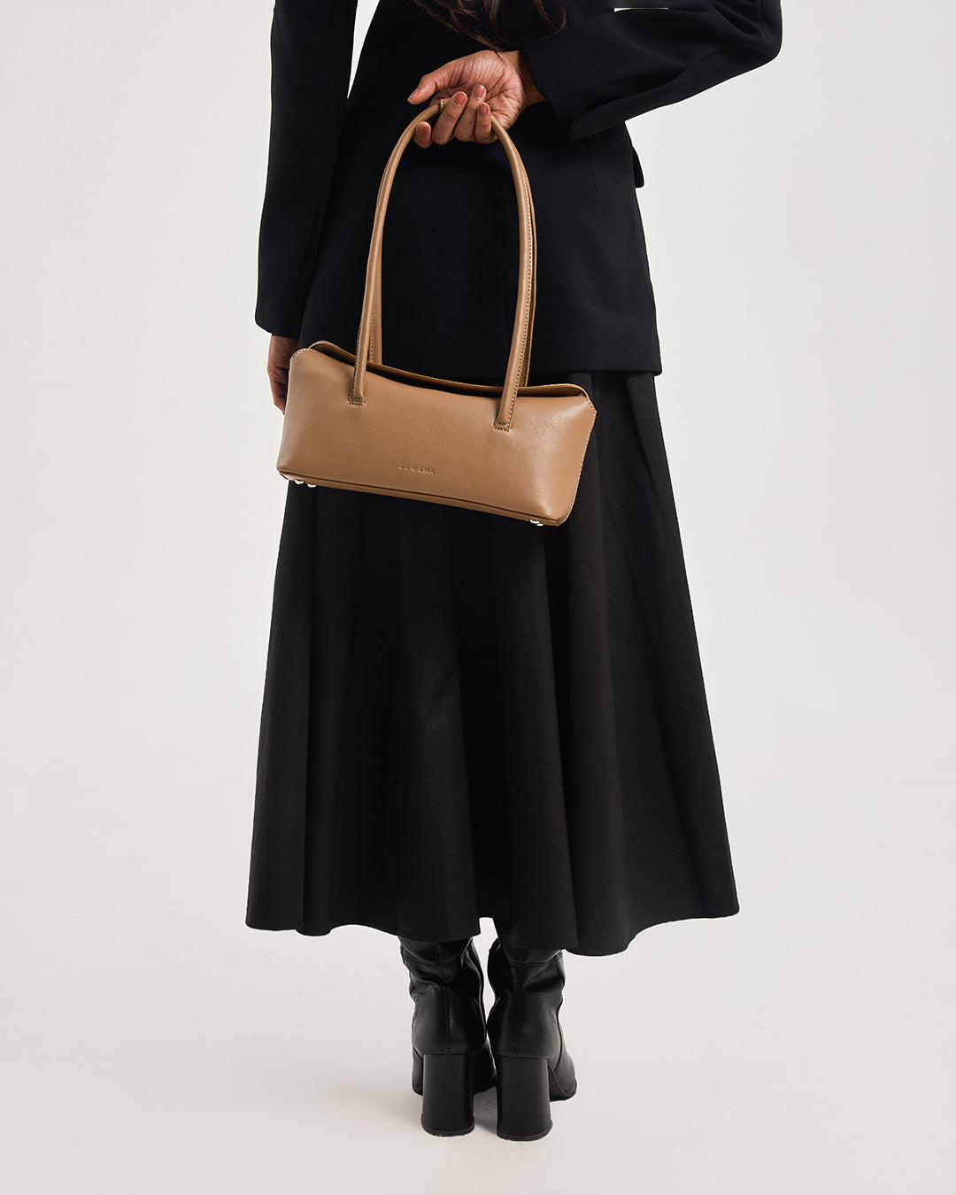 Caramel leather handbag with two top handles and structured rectangular shape