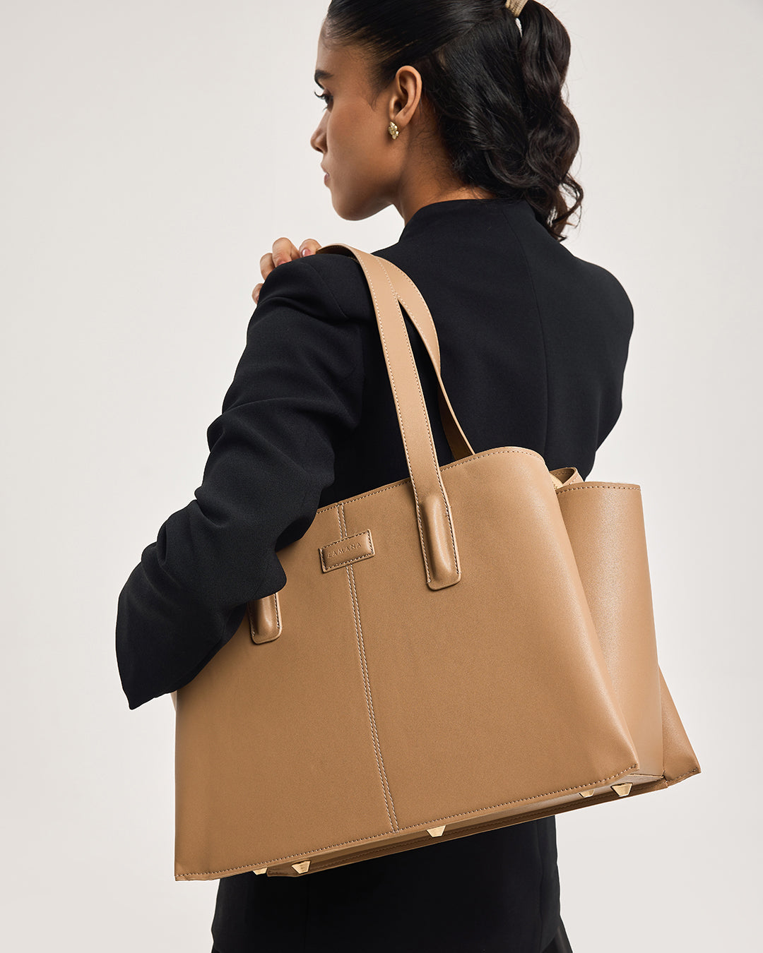 Caramel tan large tote bag with long handles and front pocket