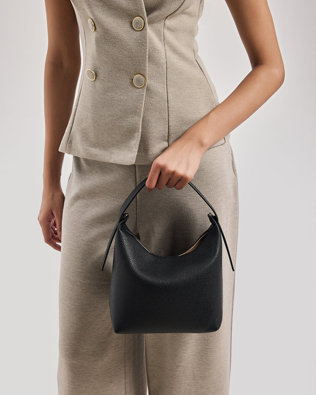 Black leather bucket handbag with curved top handles
