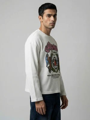 White crewneck sweatshirt on model, partial Atypical front print