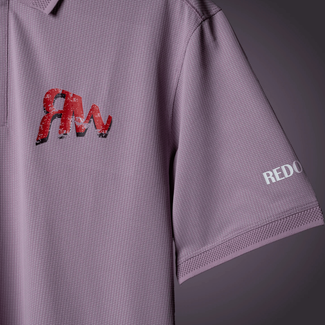 Lavender polo sleeve with “REDO” text print and “AM” graphic on the chest