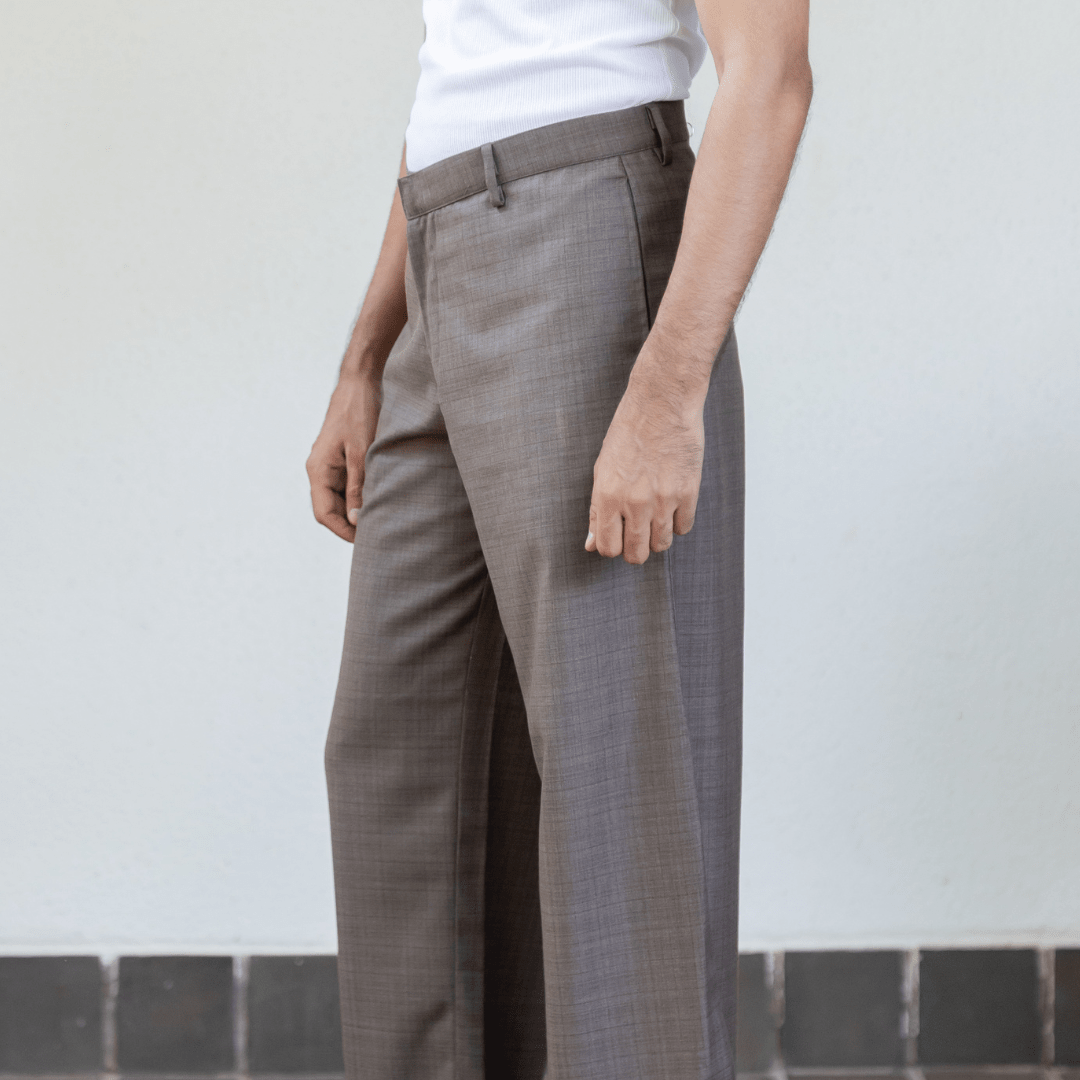 Men's formal trousers in medium gray, flat front with belt loops and button closure.