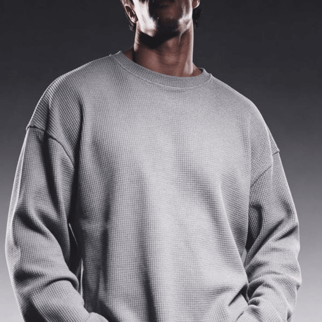 Grey waffle-knit crewneck long-sleeve sweater, front view