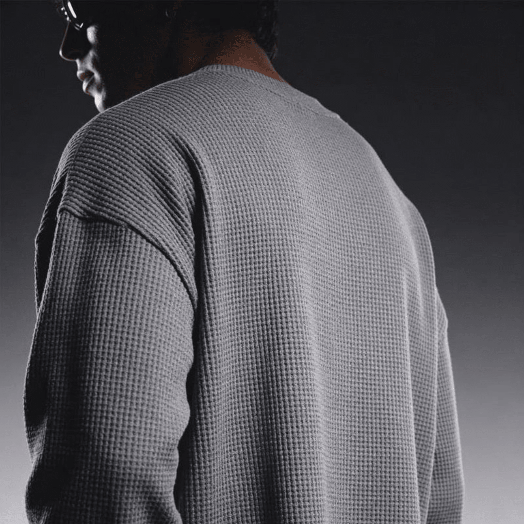 Grey waffle-knit crewneck long-sleeve sweater, back view