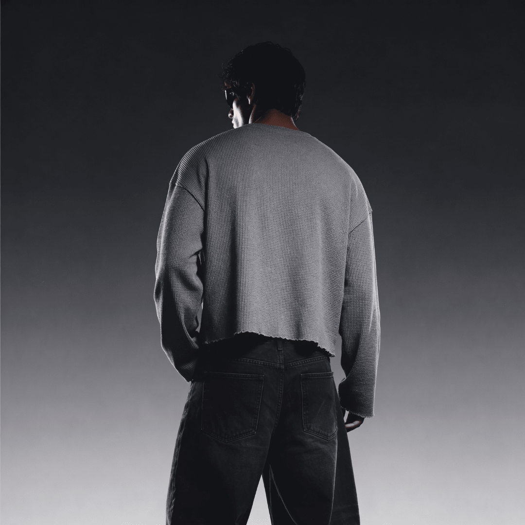 Grey waffle-knit crewneck long-sleeve sweater, back view