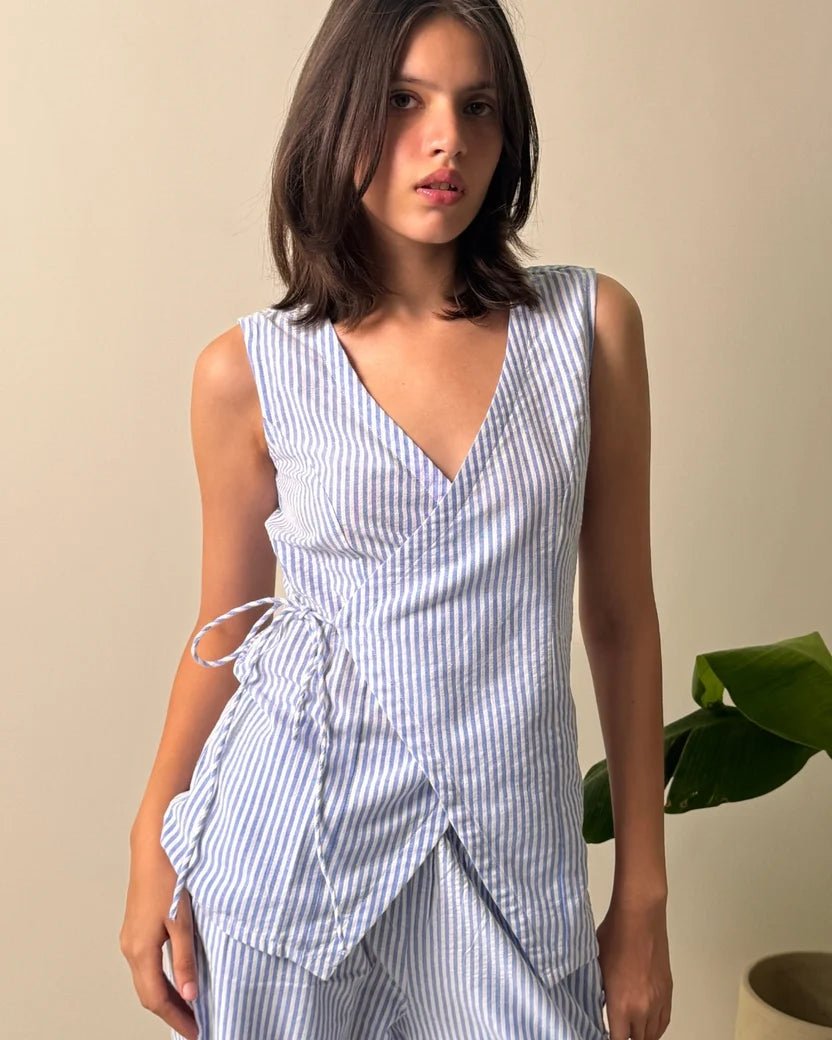 Light blue striped linen sleeveless V-neck wrap top with gathered side waist tie