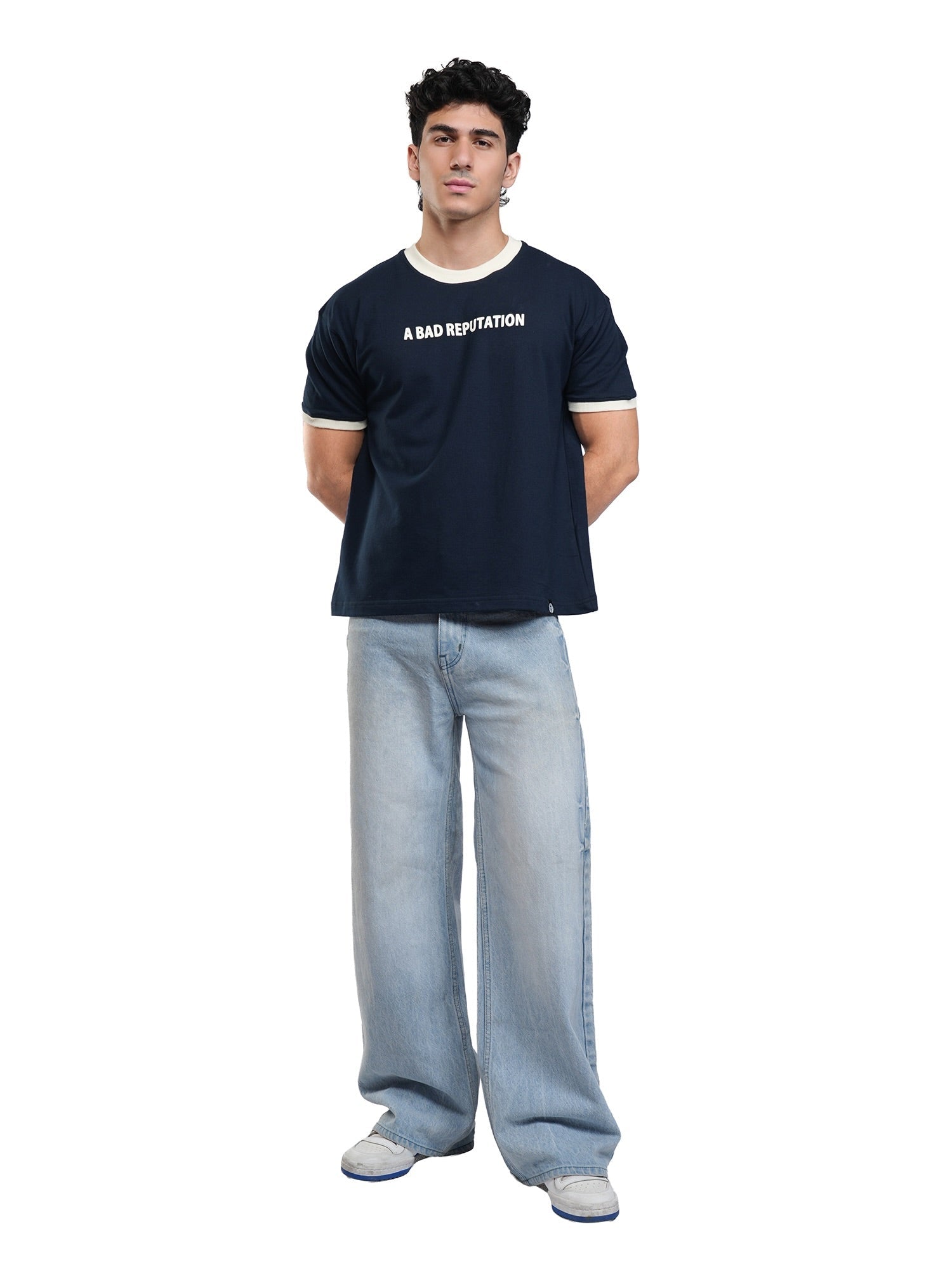 Navy ringer T-shirt with white collar and cuffs, worn with light-wash jeans