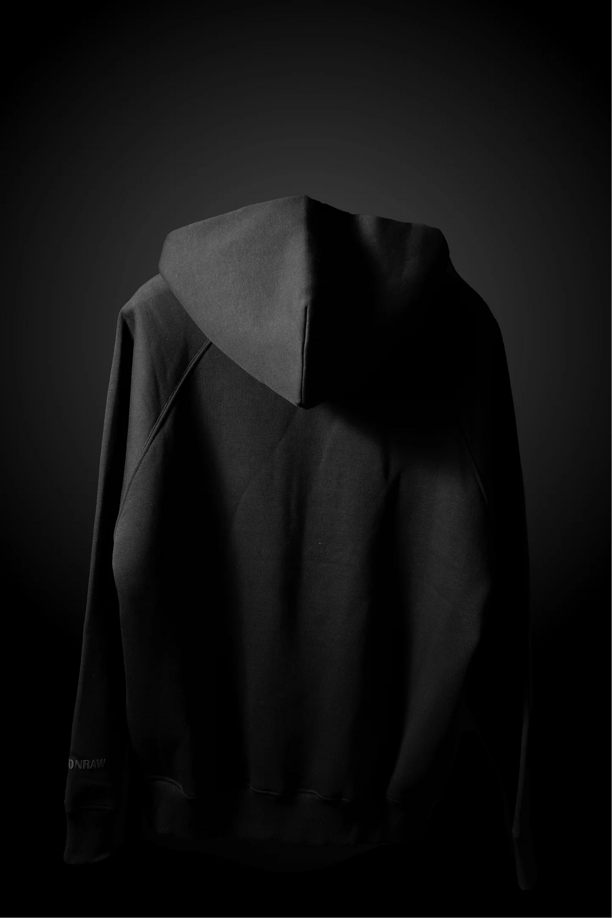 Charcoal black hoodie back view with hood and stitched seam detailing