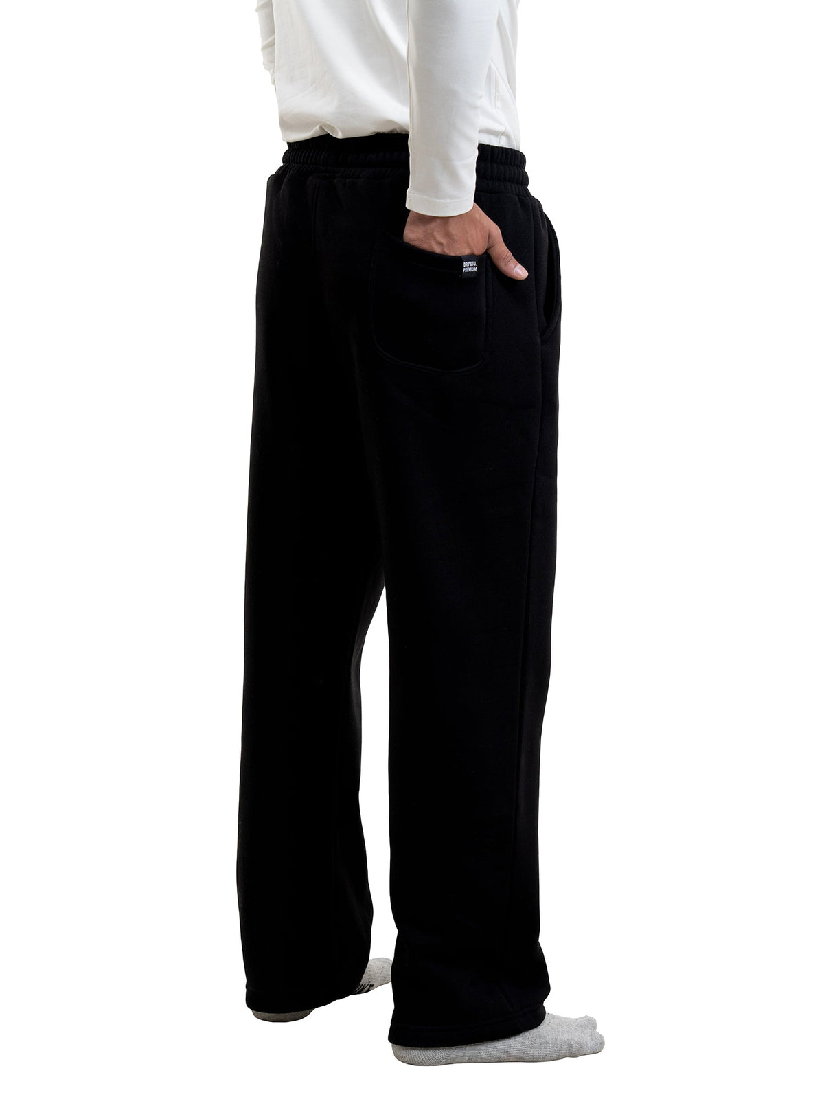 Black sweatpants with elastic waistband, drawstring, and side pockets