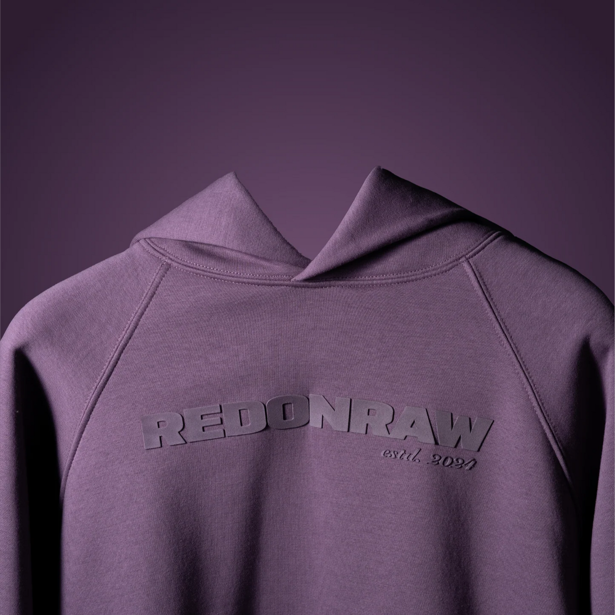 Lilac hoodie with hood and raised REDONRAW logo on the chest