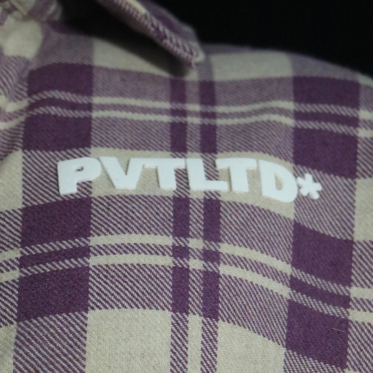 PVTLTD* logo on plaid fabric of heavyweight button-up shirt