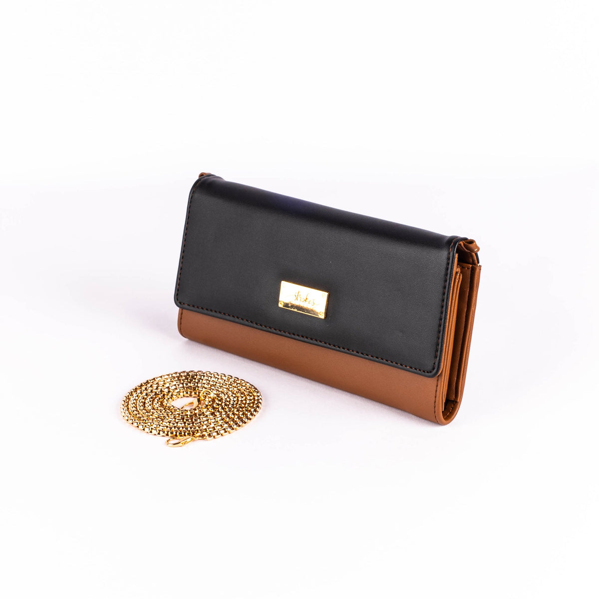 Two-tone clutch wallet with gold logo clasp and chain, black flap and caramel base