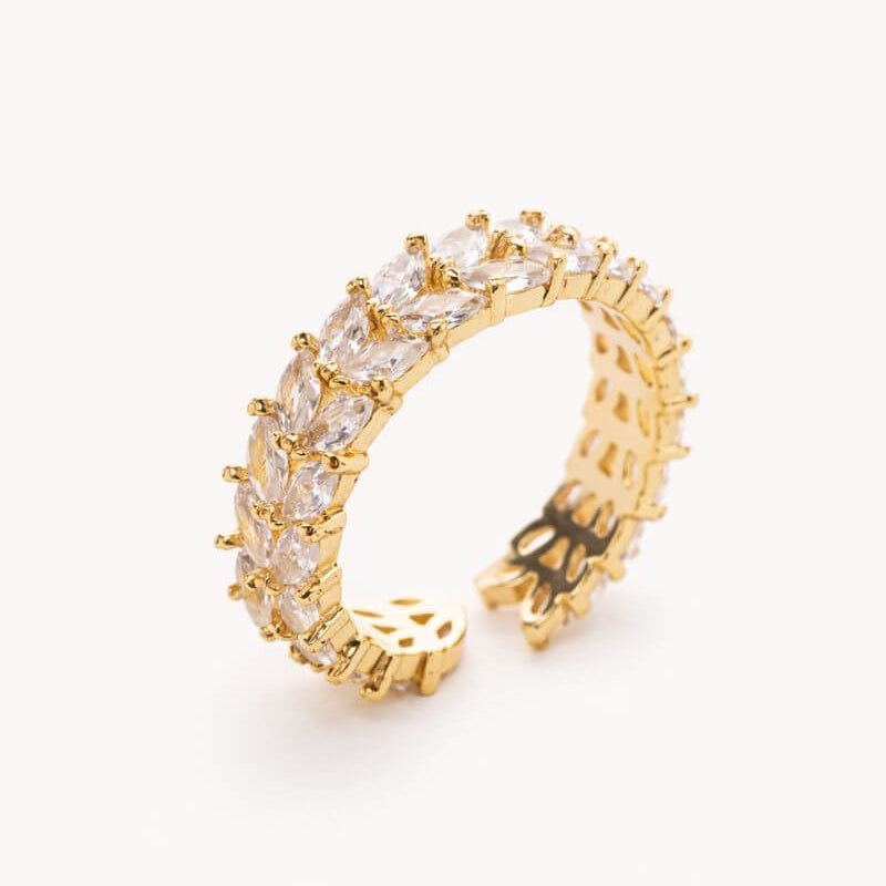 Gold-toned gemstone ring with clear marquise stones in a row