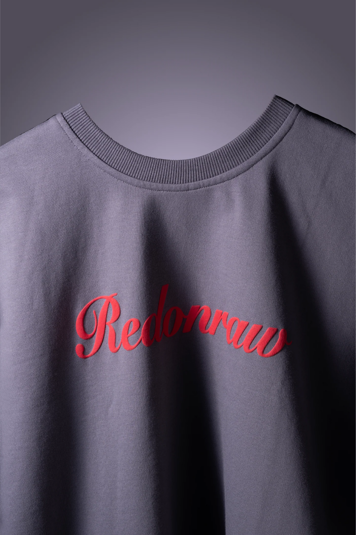 Light gray T-shirt with red 'Redonraw' script and ribbed crew neck