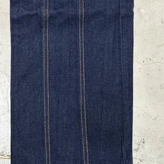 Dark blue denim fabric with vertical contrast yellow stitching and panel seams