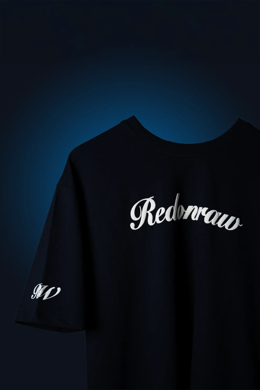 Navy blue graphic crewneck T-shirt with 'Rednoraw' script logo across the chest