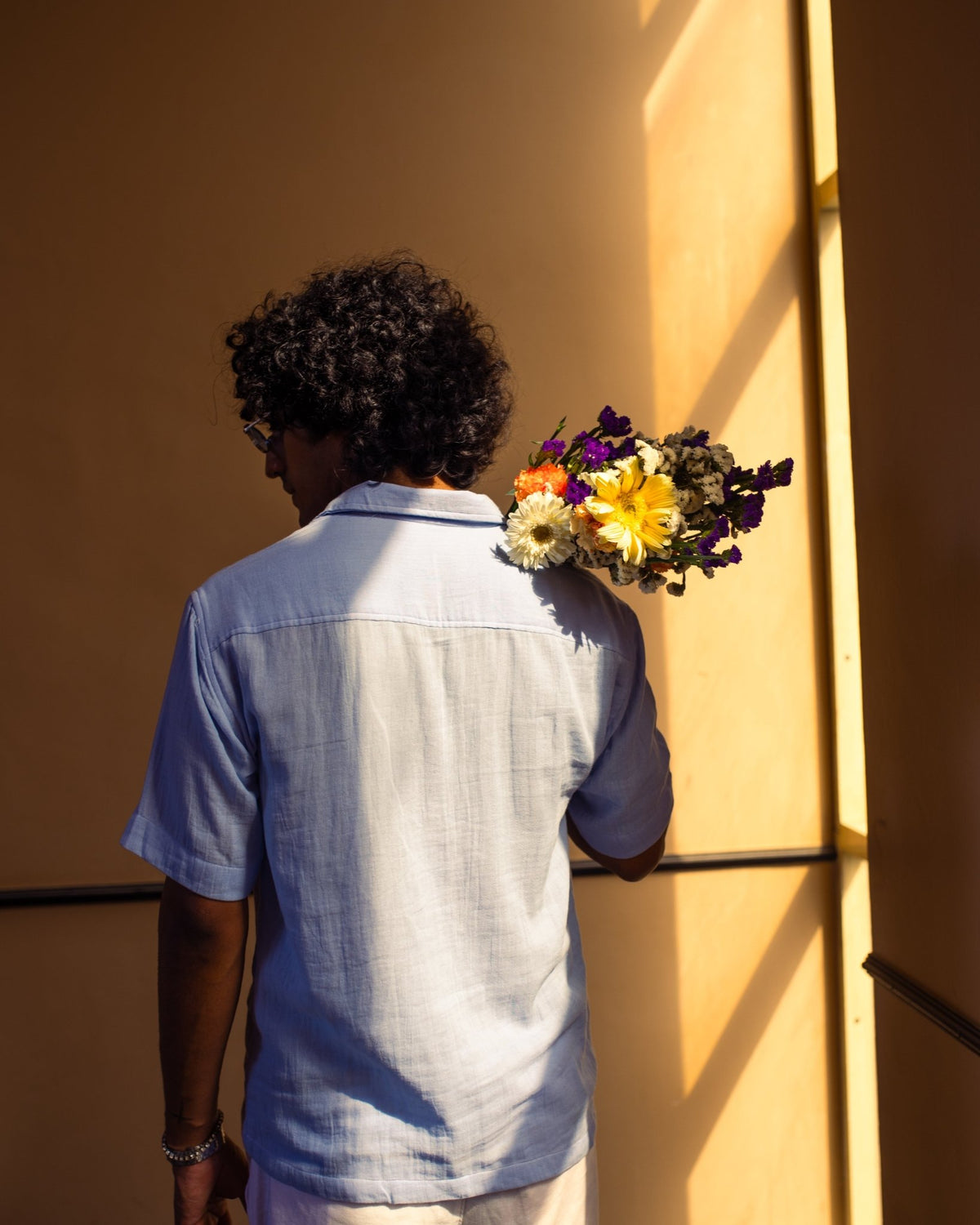 Light blue short-sleeve button-up shirt, back view with yoke and patch pocket