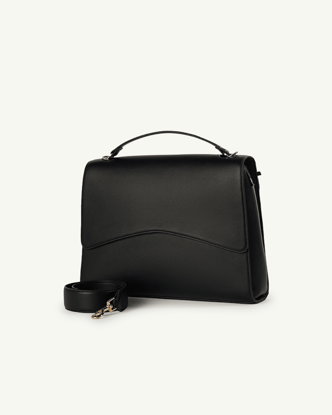 Black top-handle handbag with curved front panel and adjustable crossbody strap