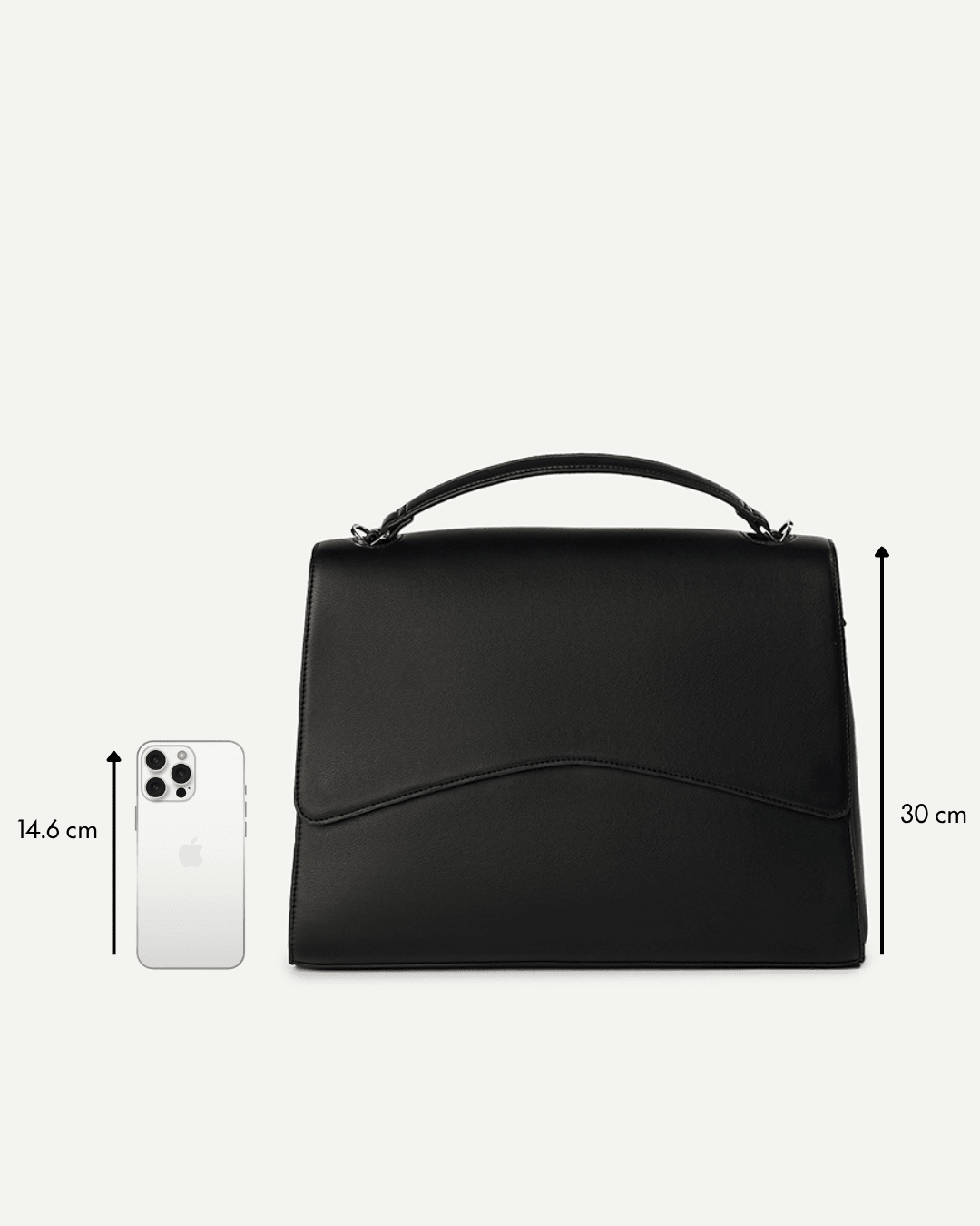 Black top-handle handbag with dimensions 30 cm height and 14.6 cm width
