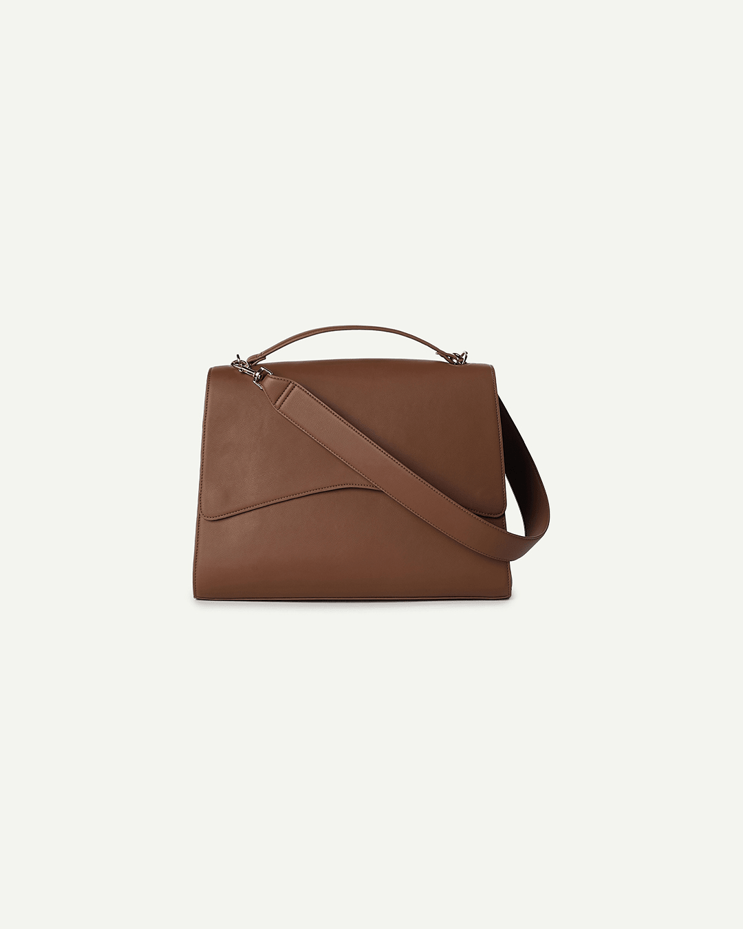 Light brown handbag with diagonal strap across front and top handle