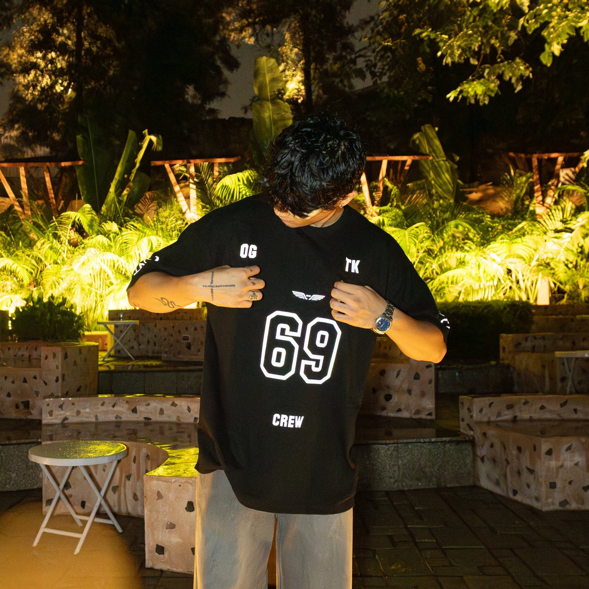 Black crew jersey T-shirt with large white '69' front print and 'CREW' text