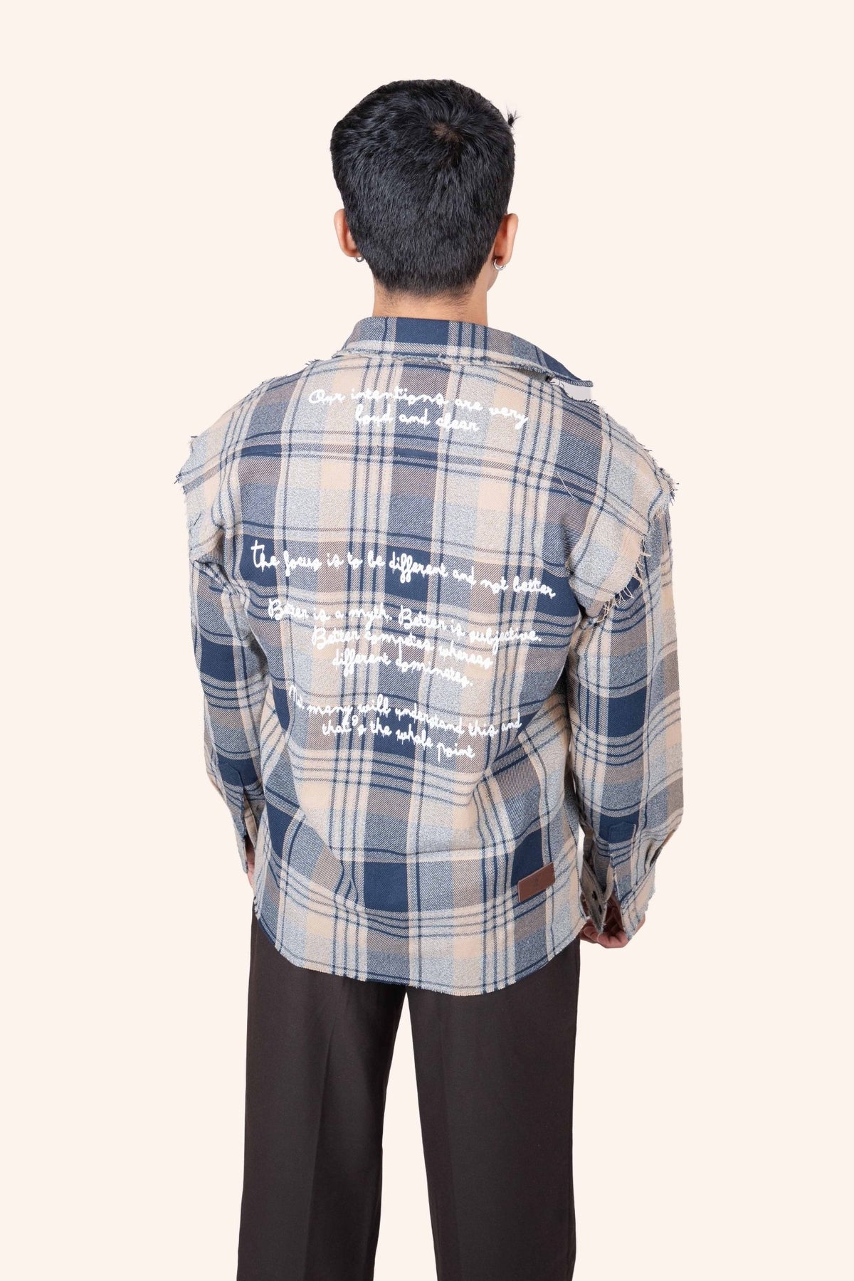Plaid flannel shirt from back, light blue and navy check, printed white graphic