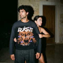 Black long-sleeve crewneck sweatshirt with colorful graphic front print