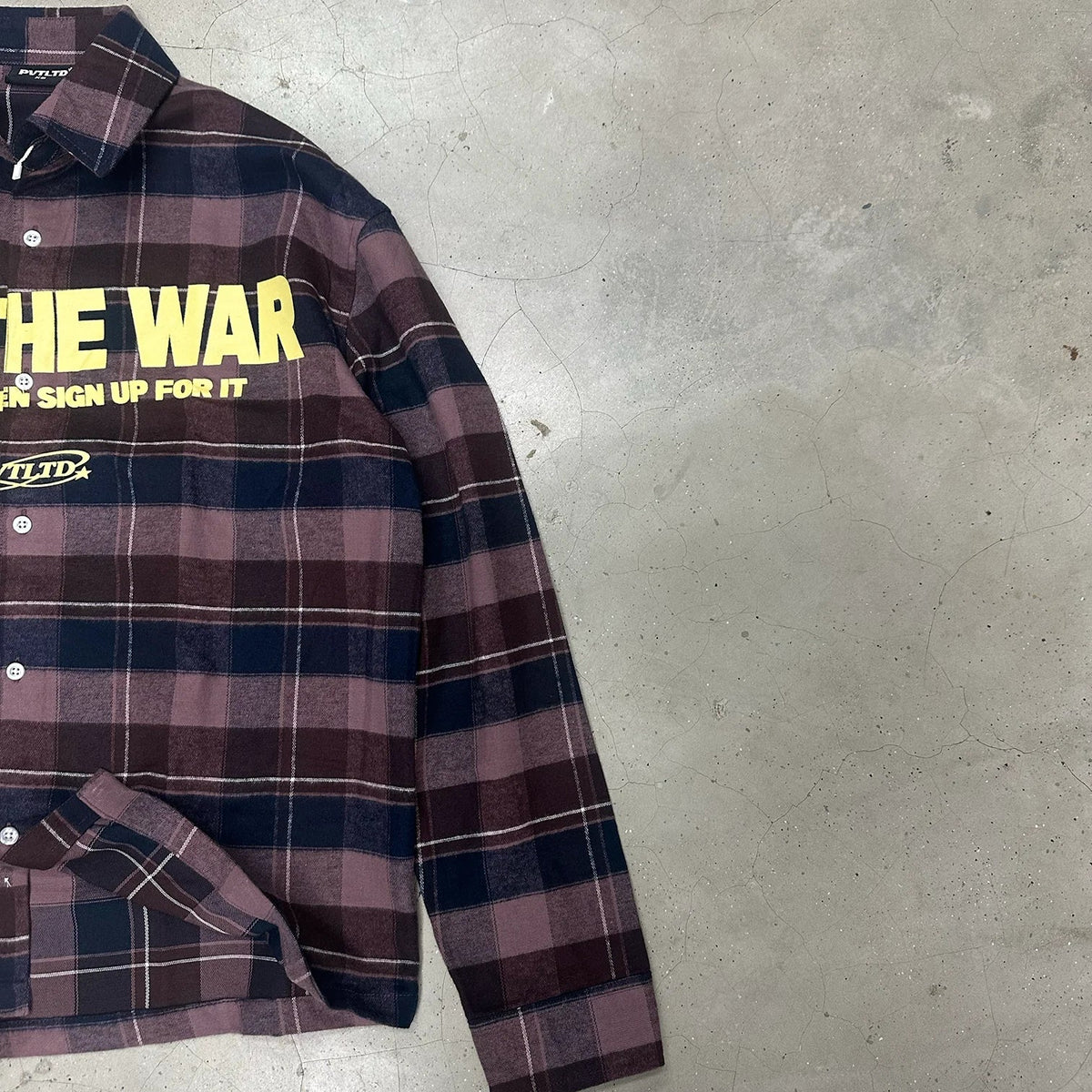 FTW shirt plaid with large yellow text graphic on chest, button front