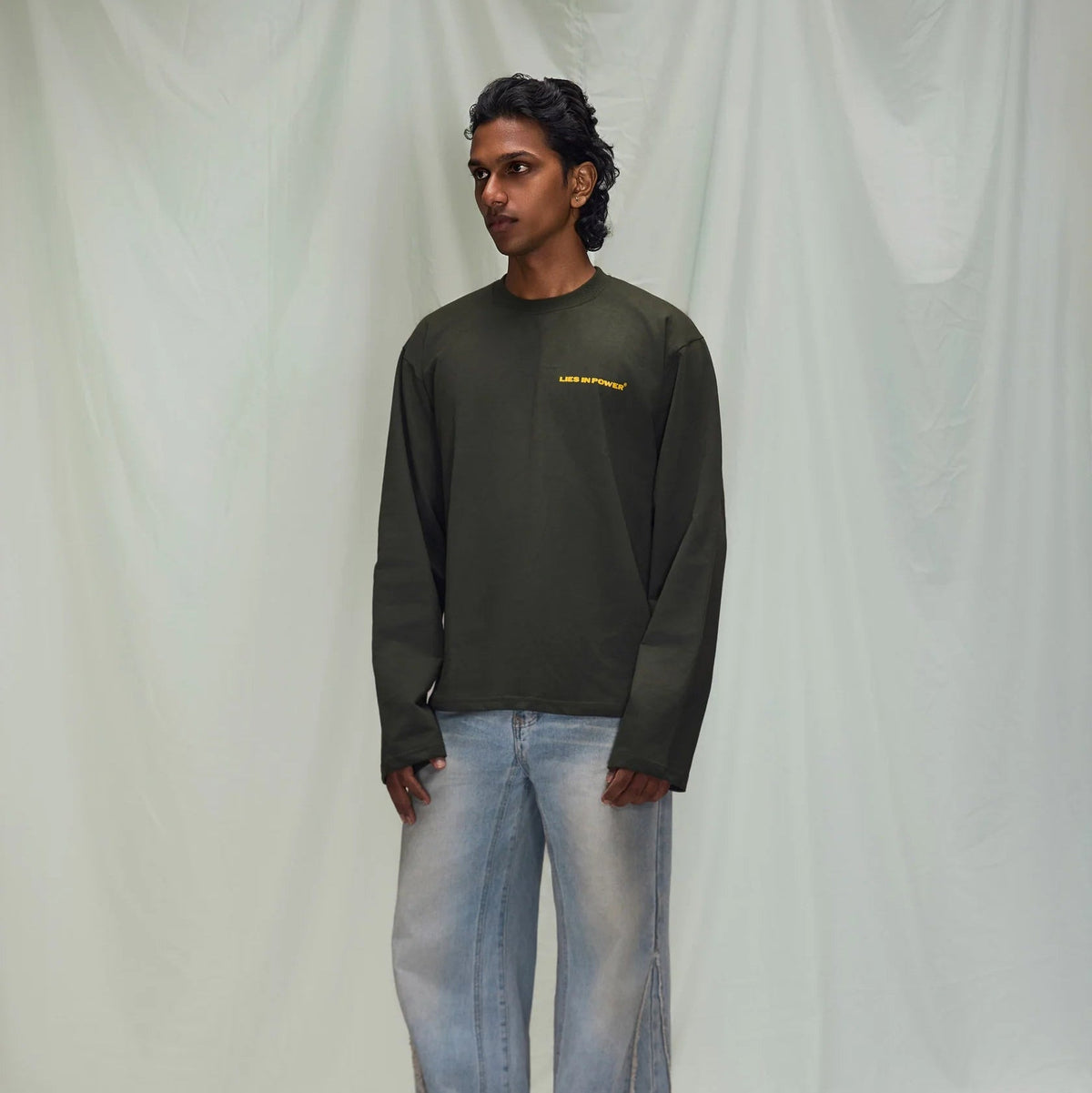 Olive green long-sleeve T-shirt front view with chest logo