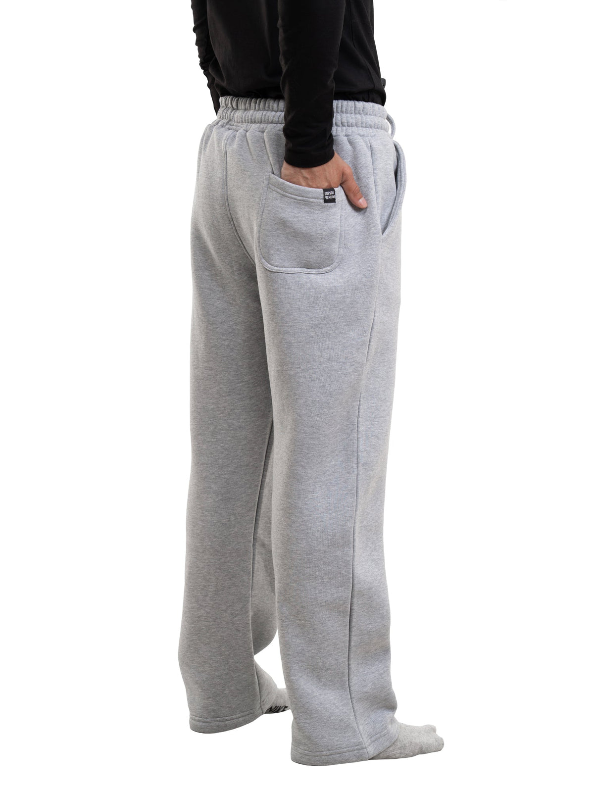 Light grey sweatpants with elastic waistband, side pockets, and relaxed straight legs