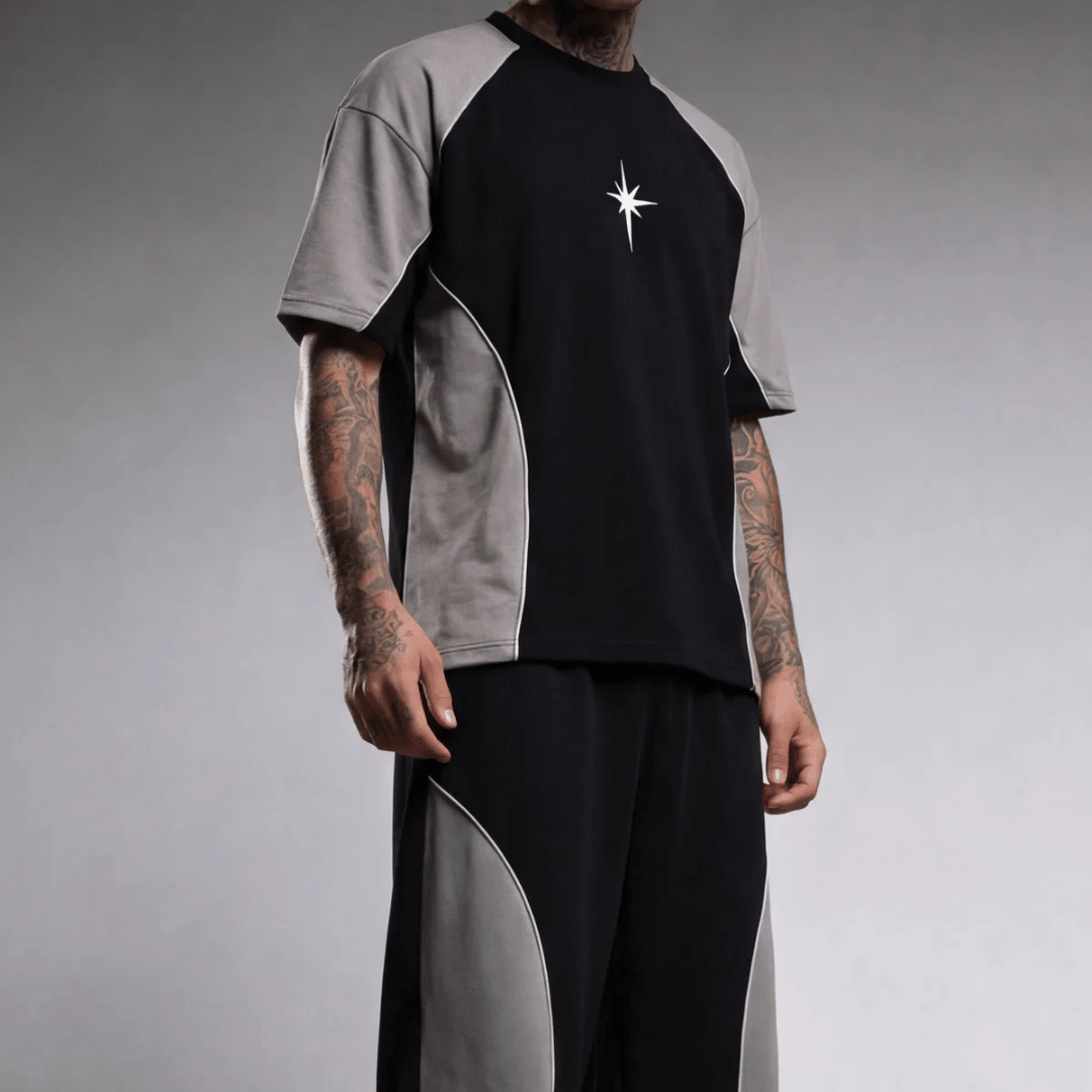 Oversized raglan T-shirt with black front, gray sleeves, and white star logo