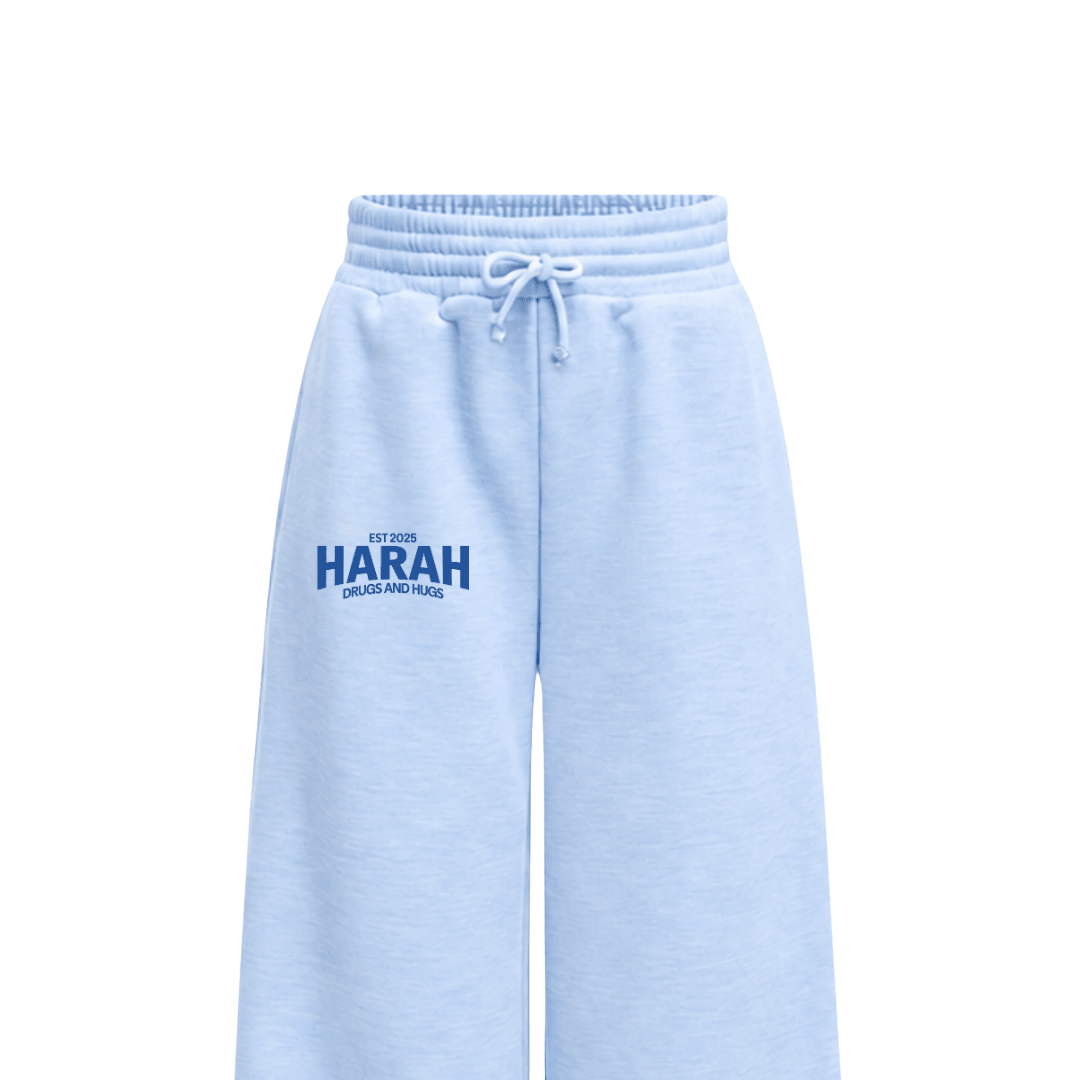Light blue sweatpants with white drawstring and EST 2025 HARAH Drugs and Hugs print
