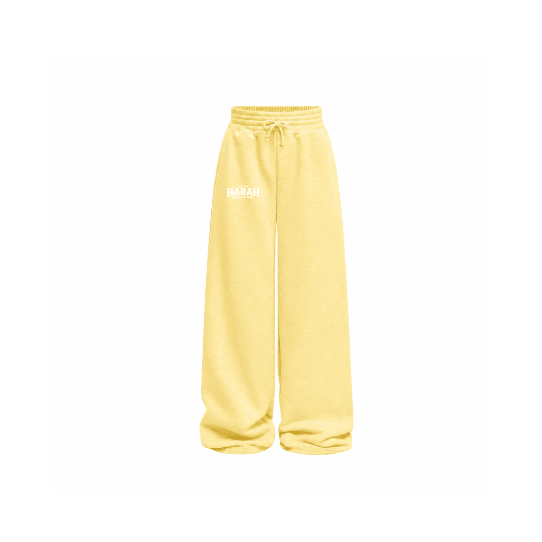 Yellow sweatpants with drawstring waistband and relaxed wide-leg fit