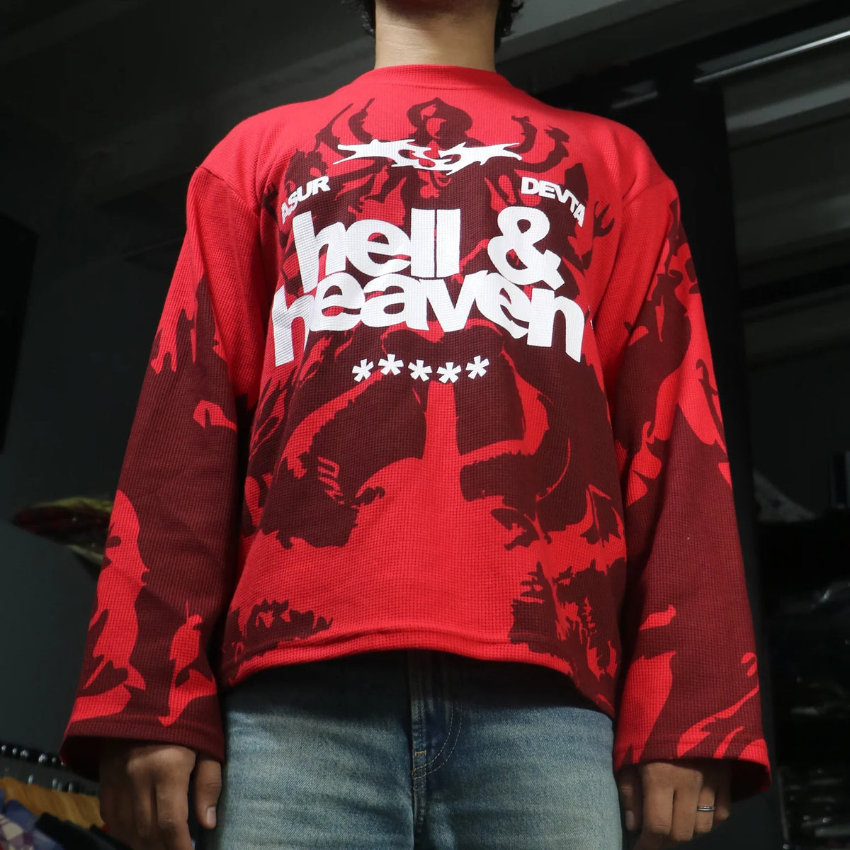 Red long-sleeve cropped waffle knit top on model, back graphic “hell & heaven” print