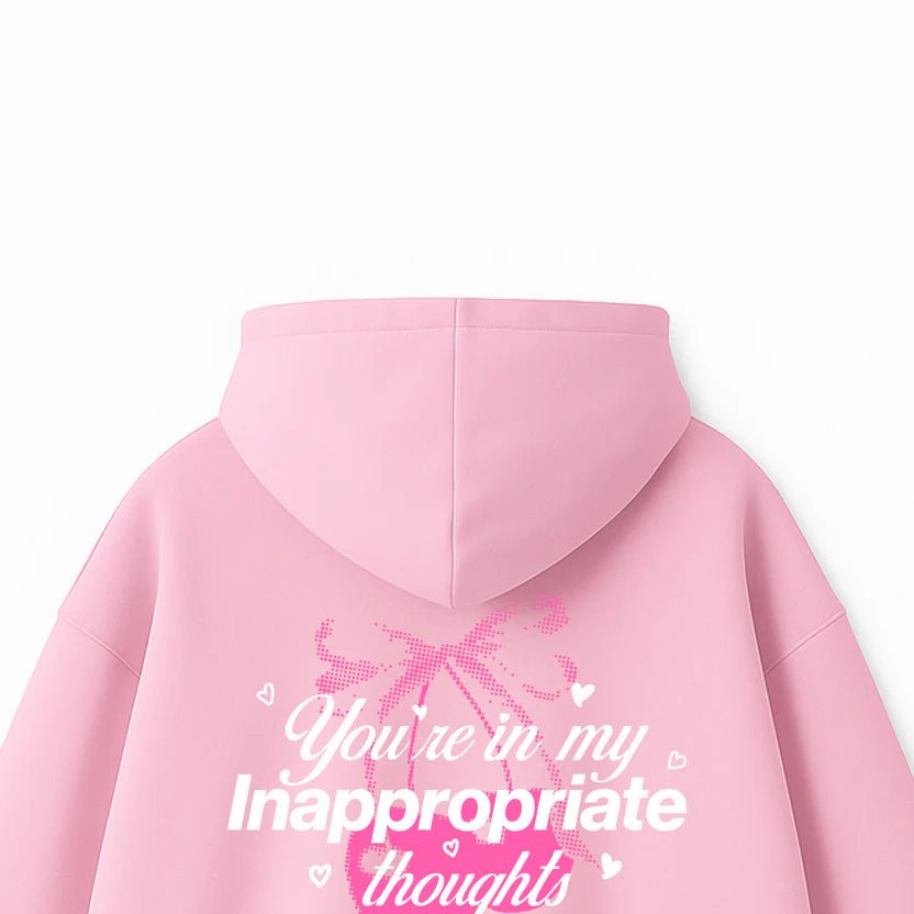 Pink hoodie back close-up: large text and heart graphic