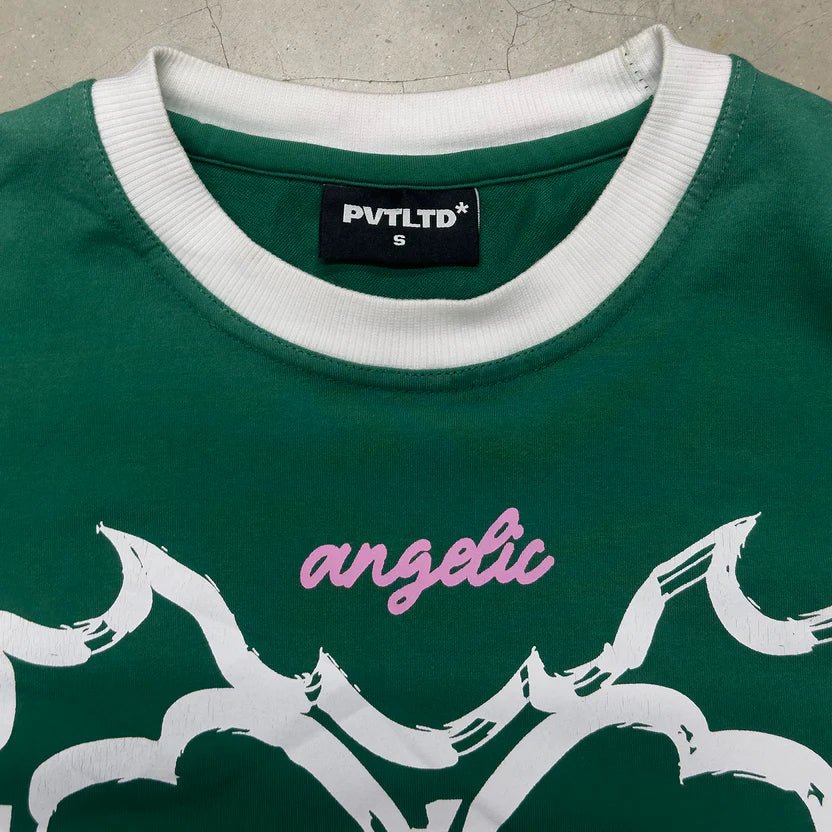Green sleeveless T-shirt with PVTLTD label and white graphic with pink 'angelic'