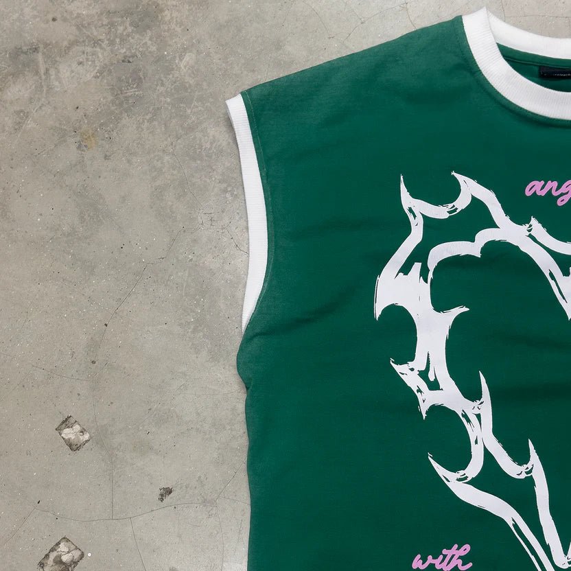 Green sleeveless T-shirt with large white graphic on chest, pink script accents