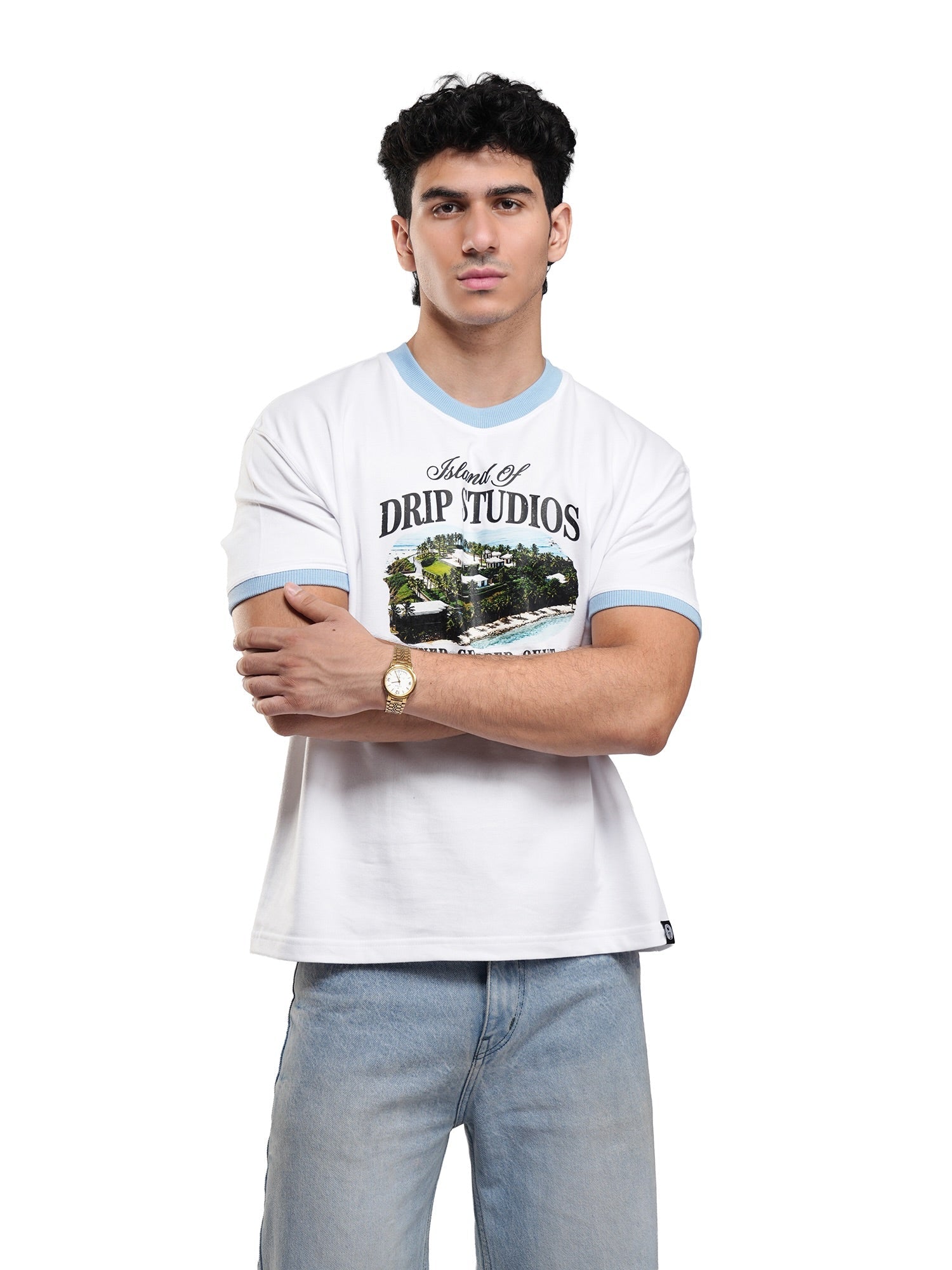 White ringer tee with light blue trim and front graphic print; man standing with arms crossed