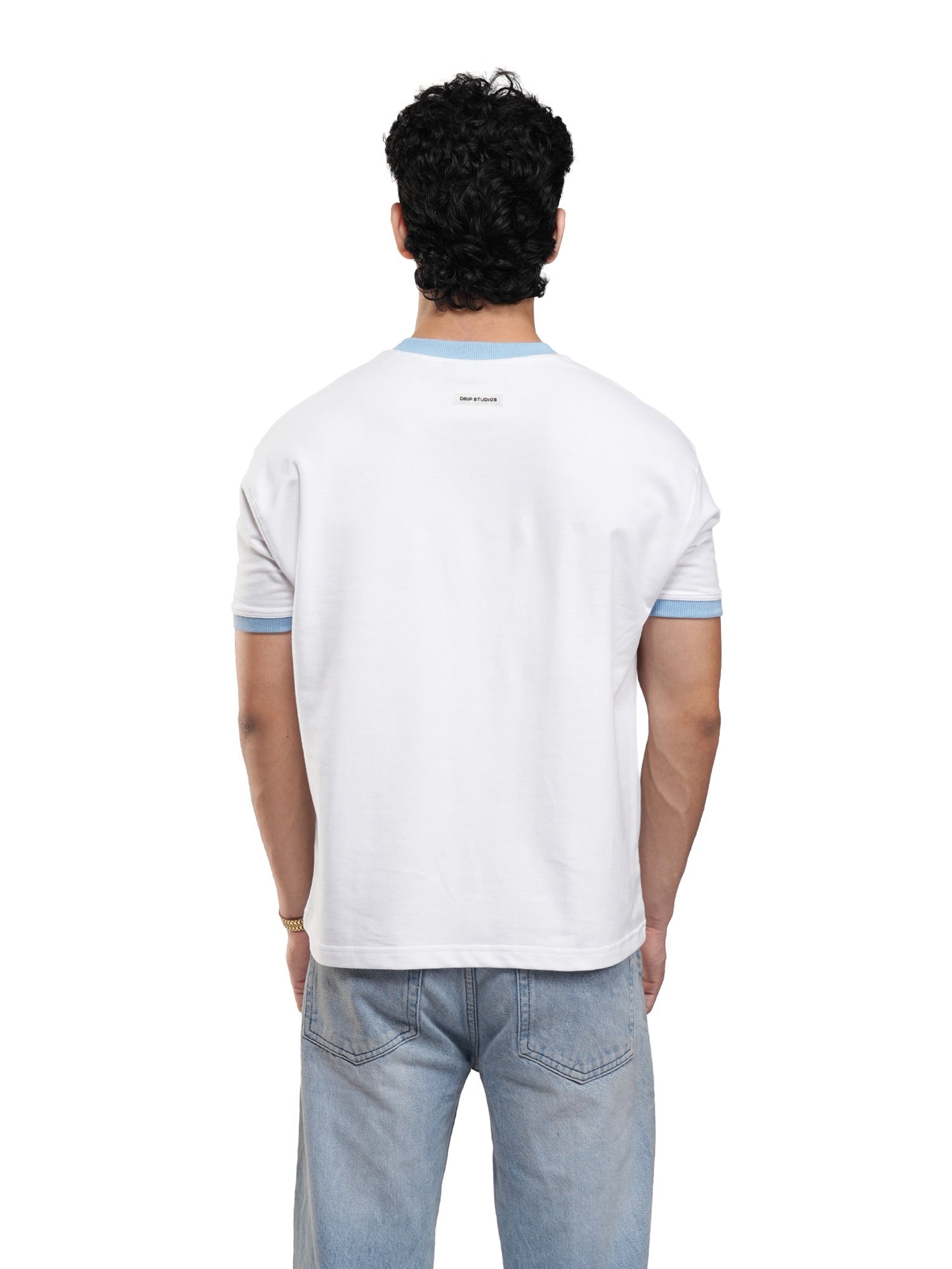 Back view of white ringer tee with light blue trim on neckline and sleeve cuffs