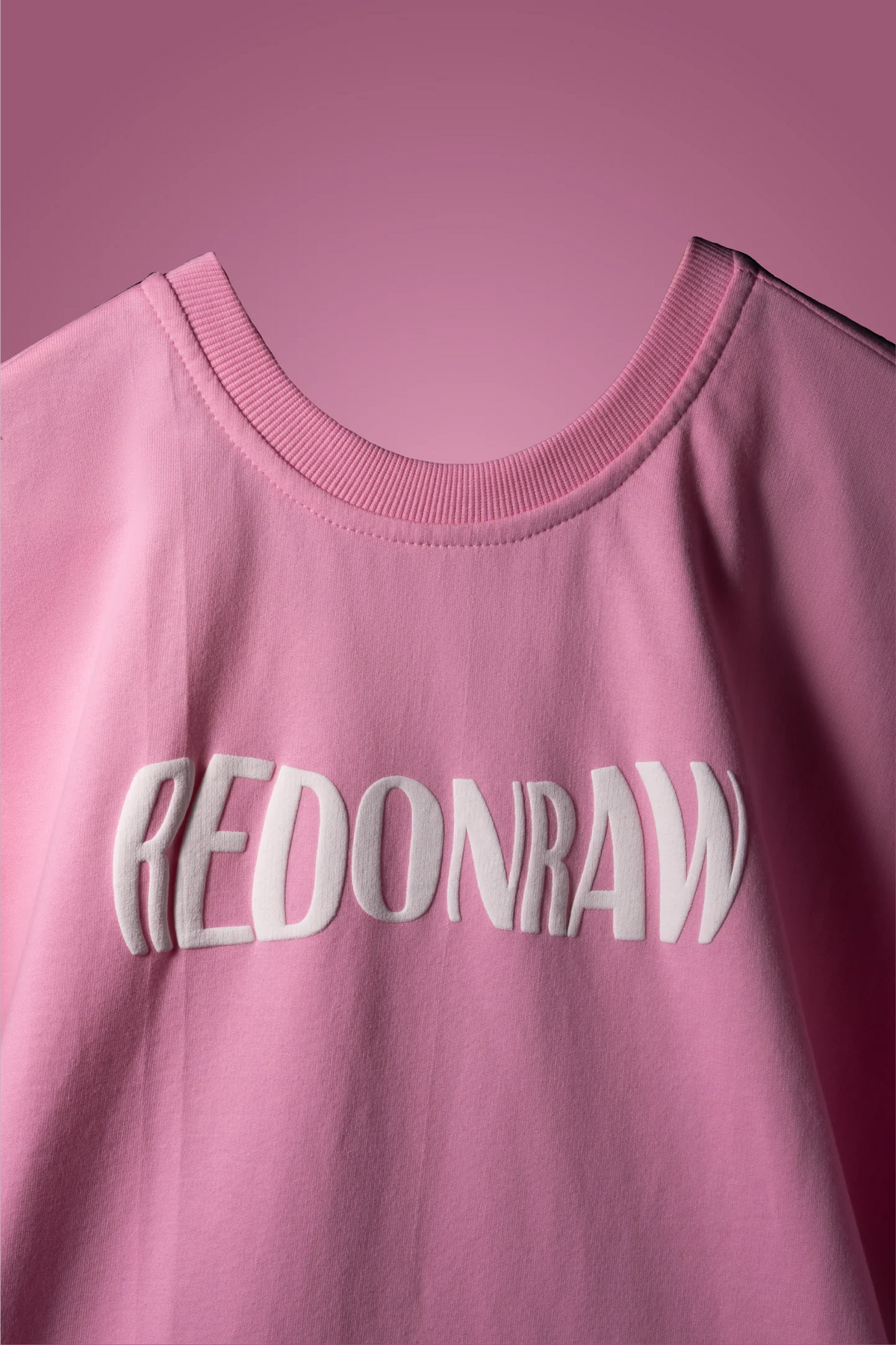 Baby pink T-shirt with REDONRAW front graphic and crew neck ribbing