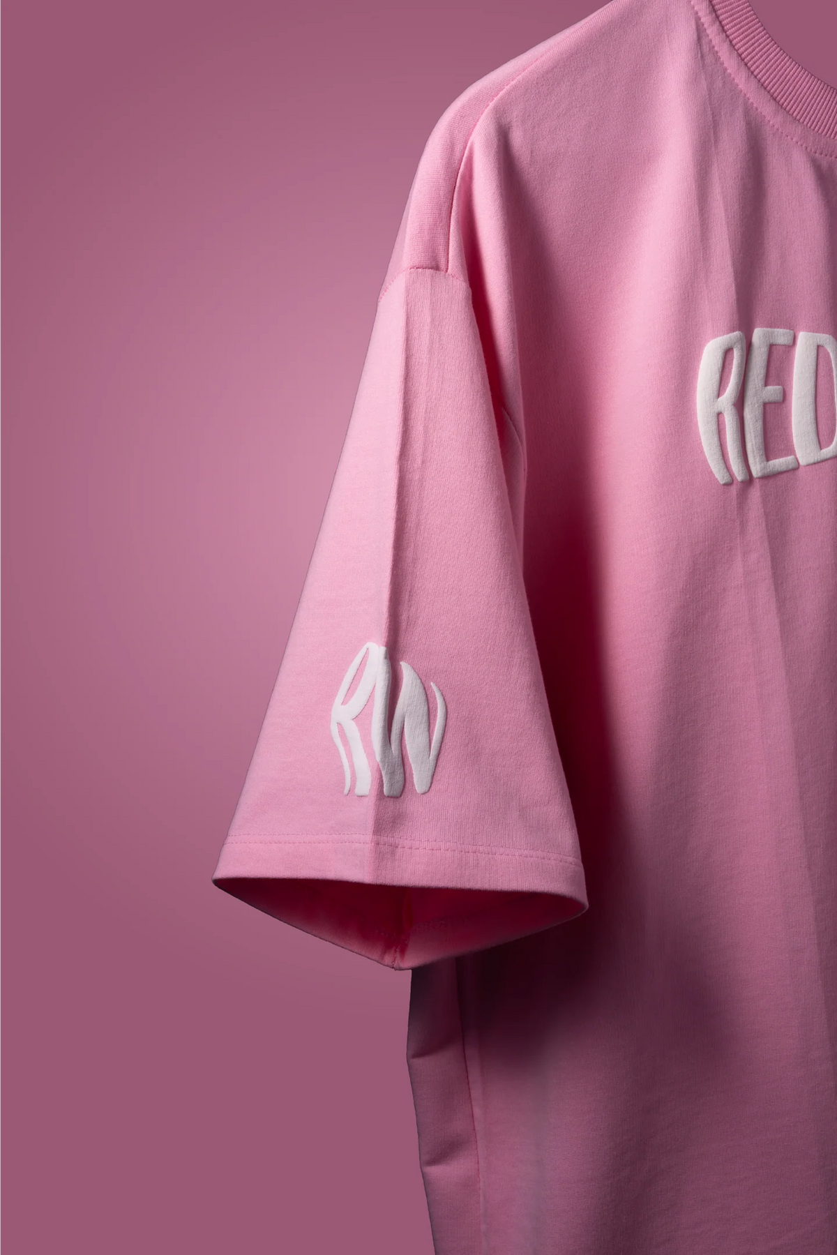Baby pink graphic T-shirt with sleeve and partial front print