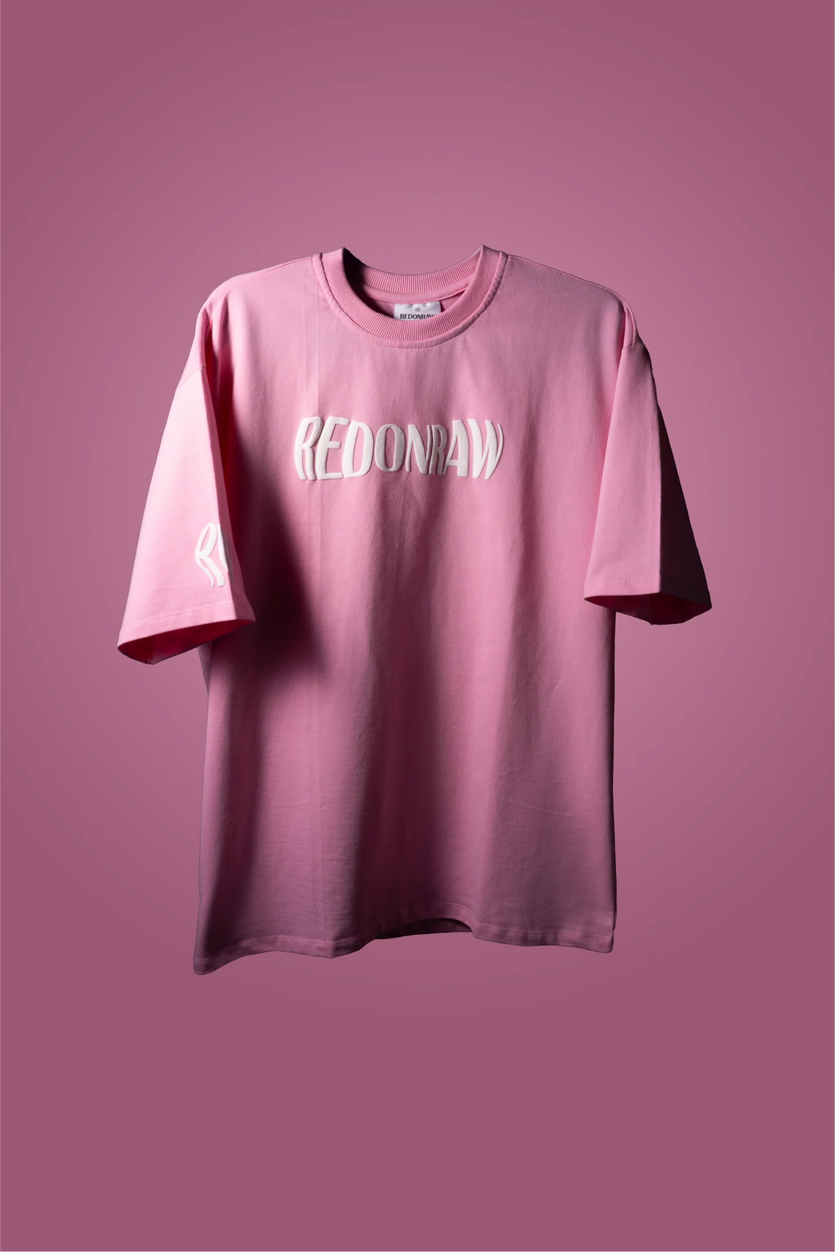 Baby pink graphic T-shirt with REDONRAW front logo print