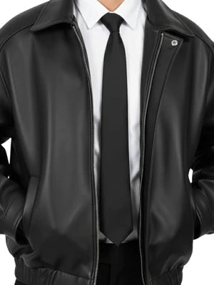 Matte black leather jacket close-up of zipper placket and stand collar