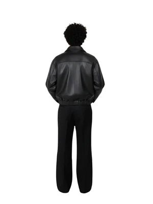 Matte black leather jacket, back view with zipper collar and elastic waist hem