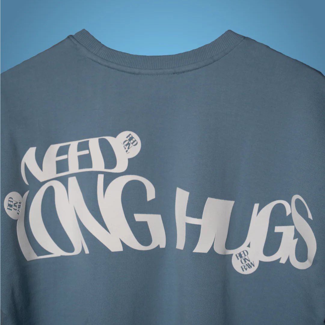 Light blue T-shirt with large white back typography and small RAW badge detail