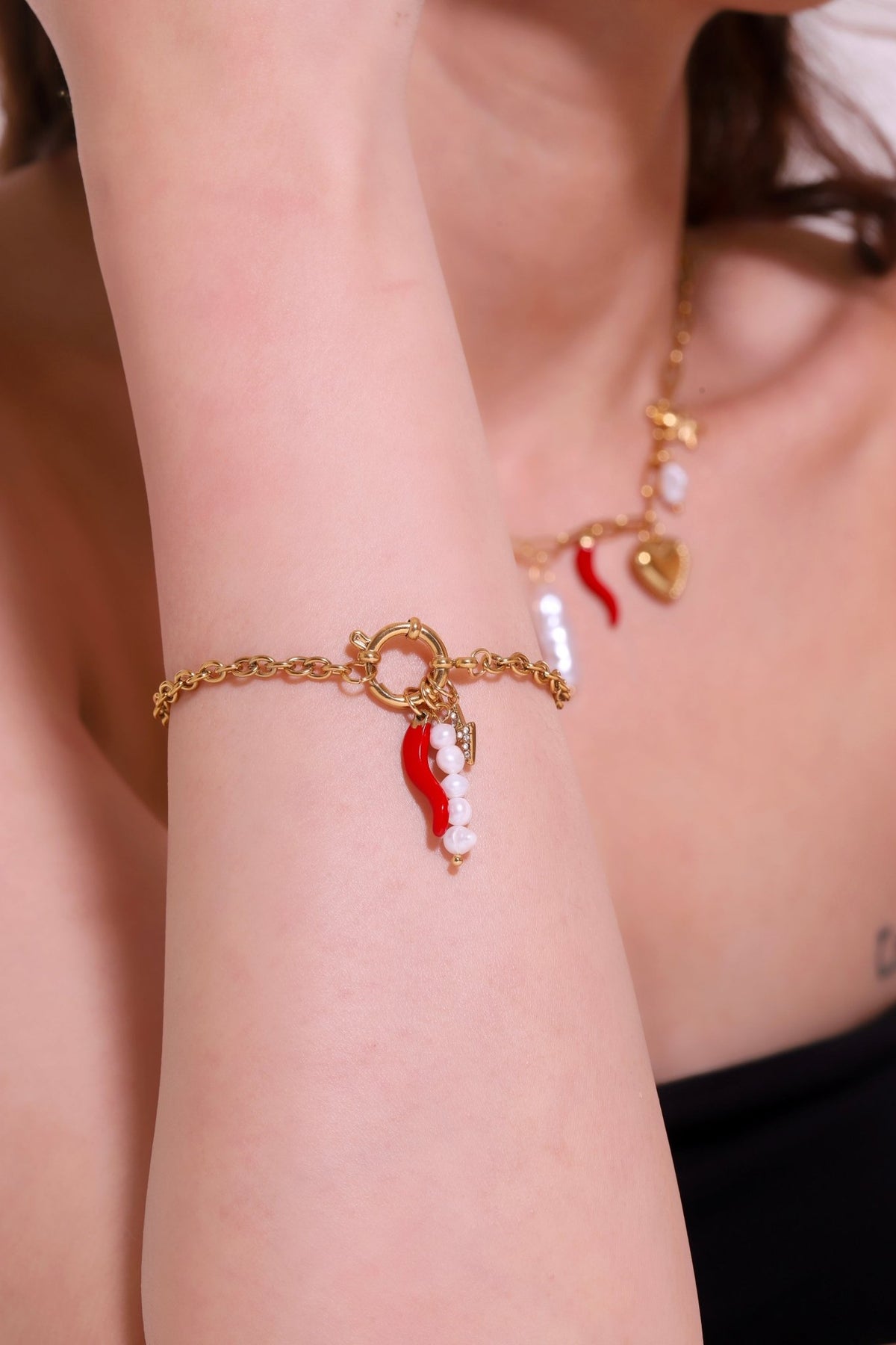 Gold charm bracelet with red chili pepper and white pearl drops