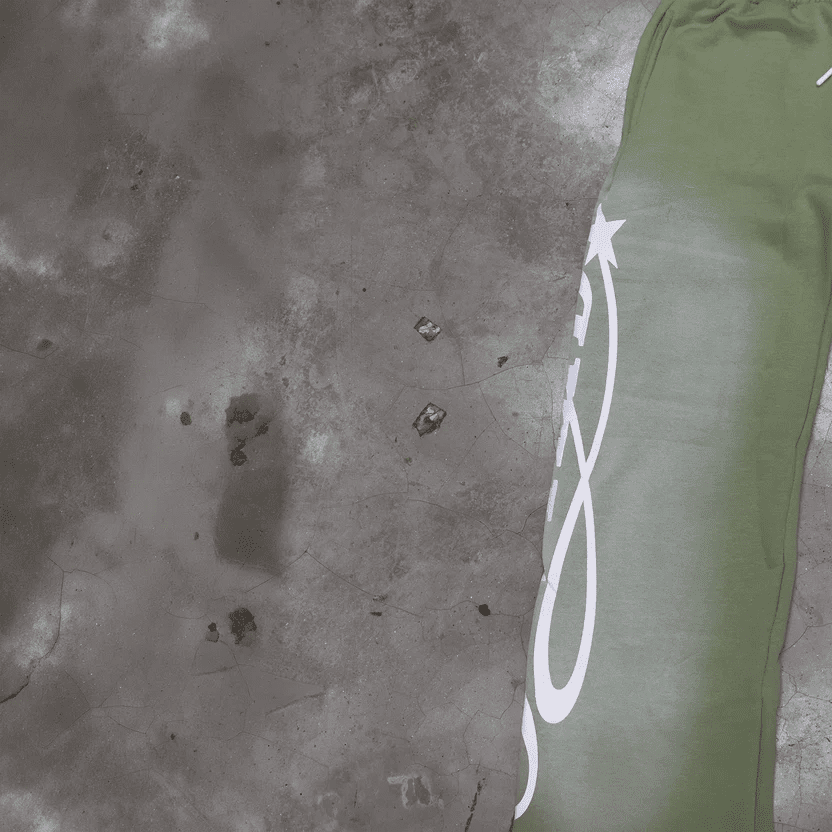 Light green track pants partial view with white side logo print